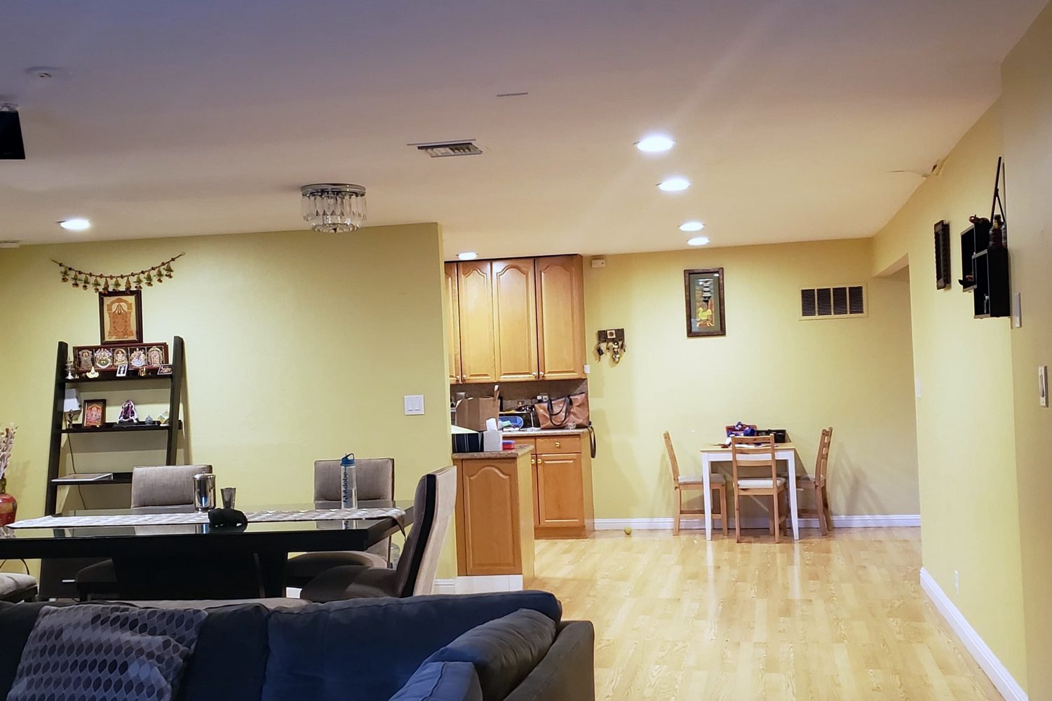Living room before — dated fireplace, closed layout