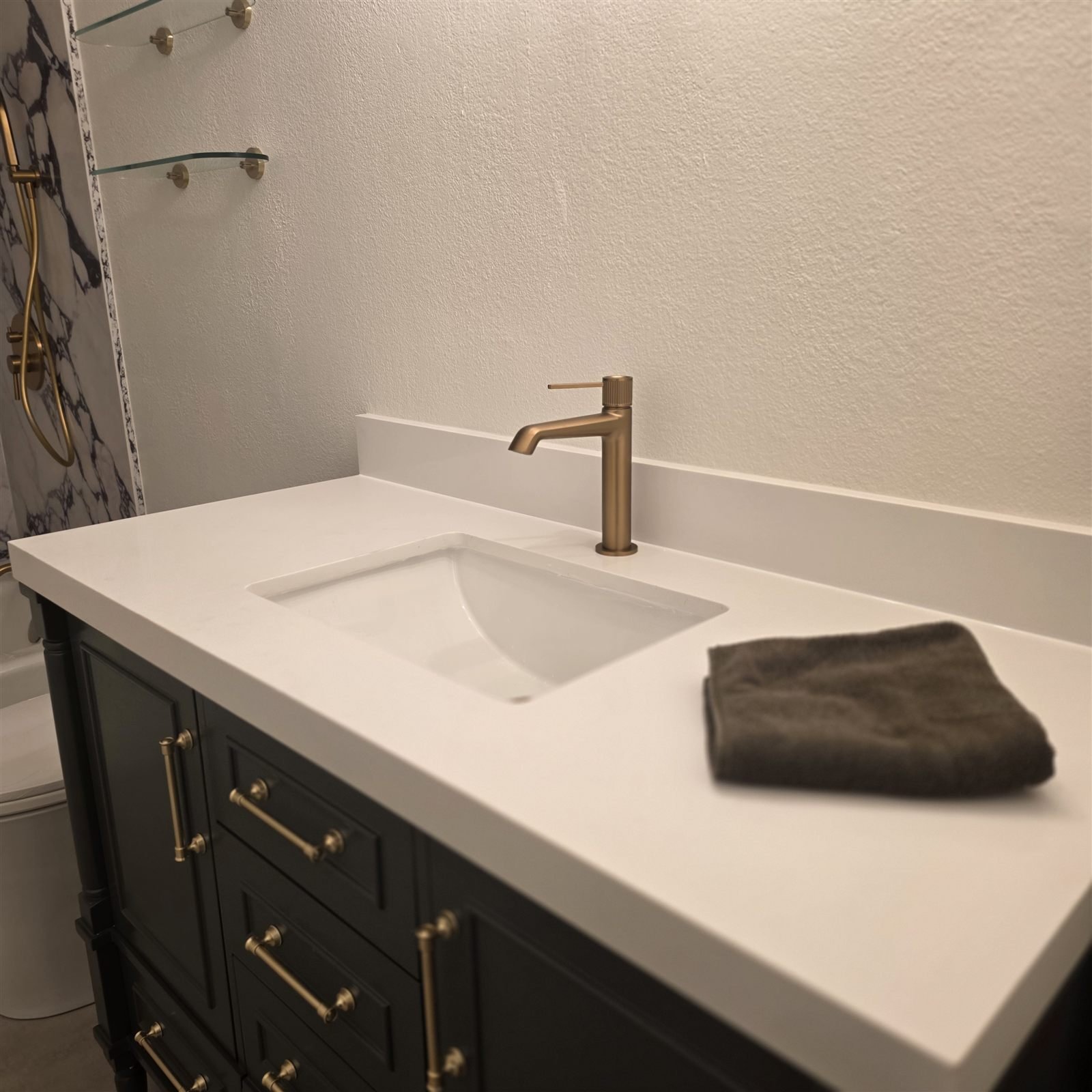 Custom vanity with brass fixtures by Duran PMR