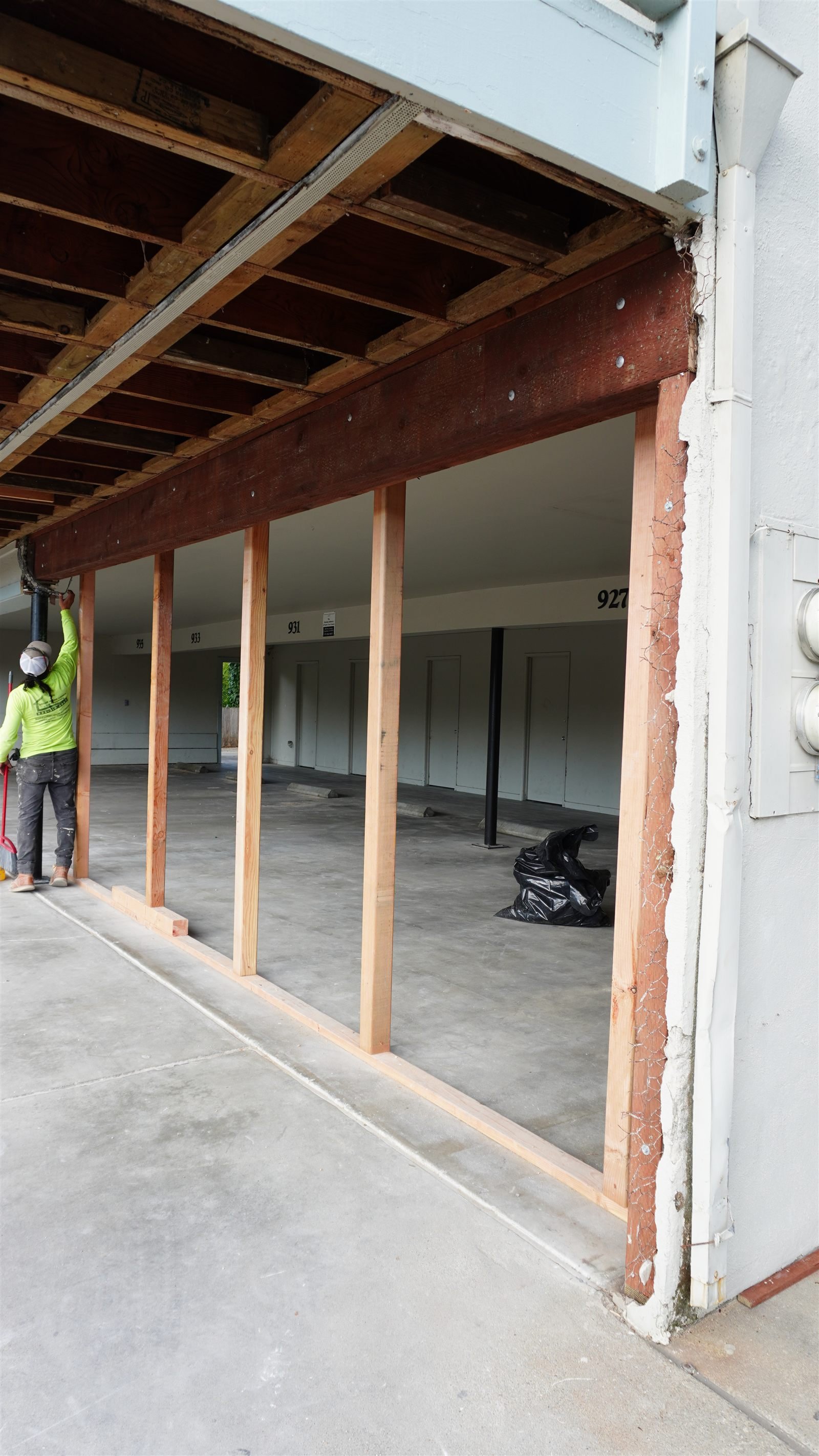 Crew reframing walkway structure