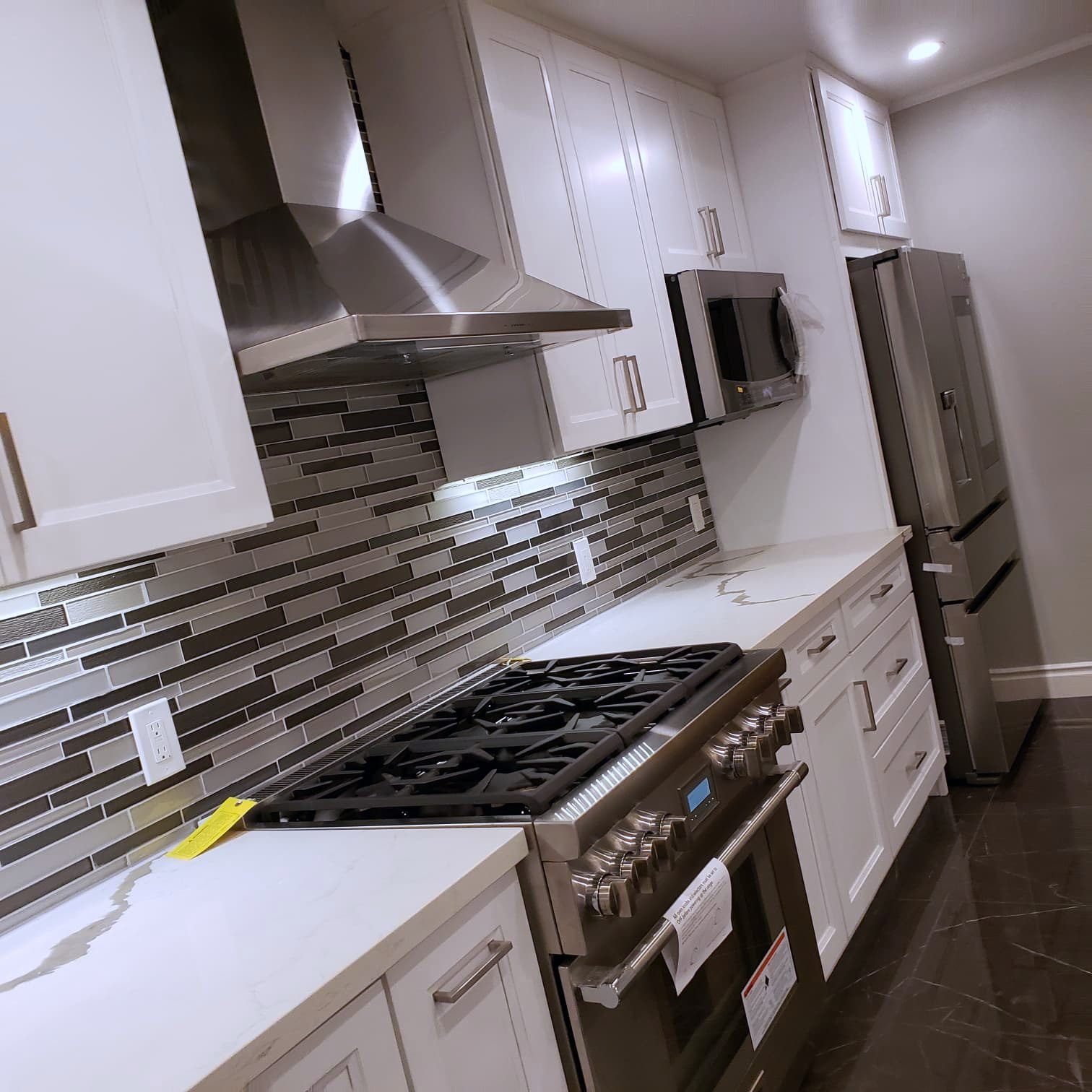 Professional range with mosaic backsplash
